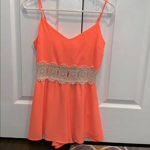 bright pink/orange romper with lace cutout